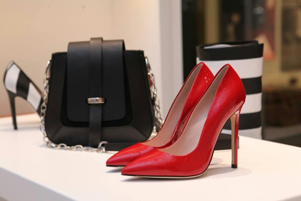 pexels-photo-336372-336372-1 Showcasing sleek red stilettos and a chic black handbag in a luxury boutique setting.